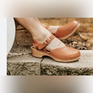 Leather and wood clogs